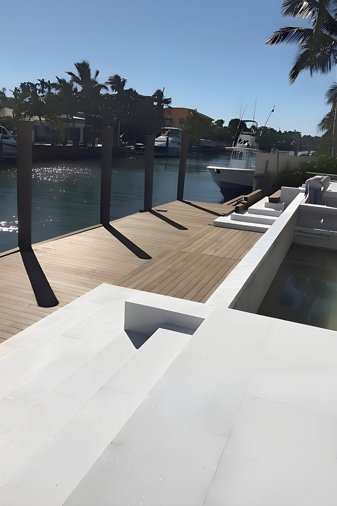 Ipe wood dock with seawall steps and boat lift posts — South Florida waterfront