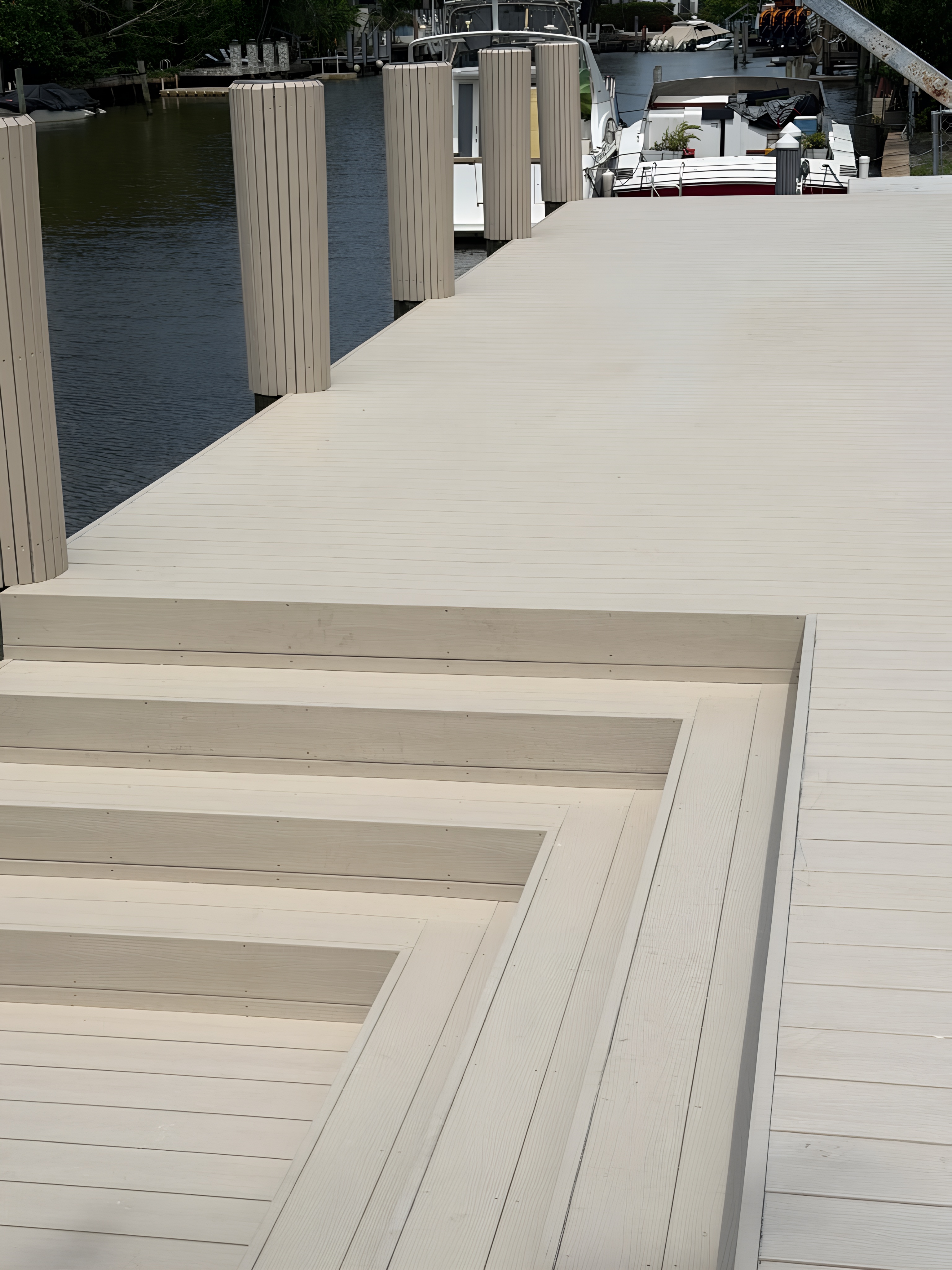 Completed composite dock with wrapped pilings and finished stair system — Contour Marine South Florida