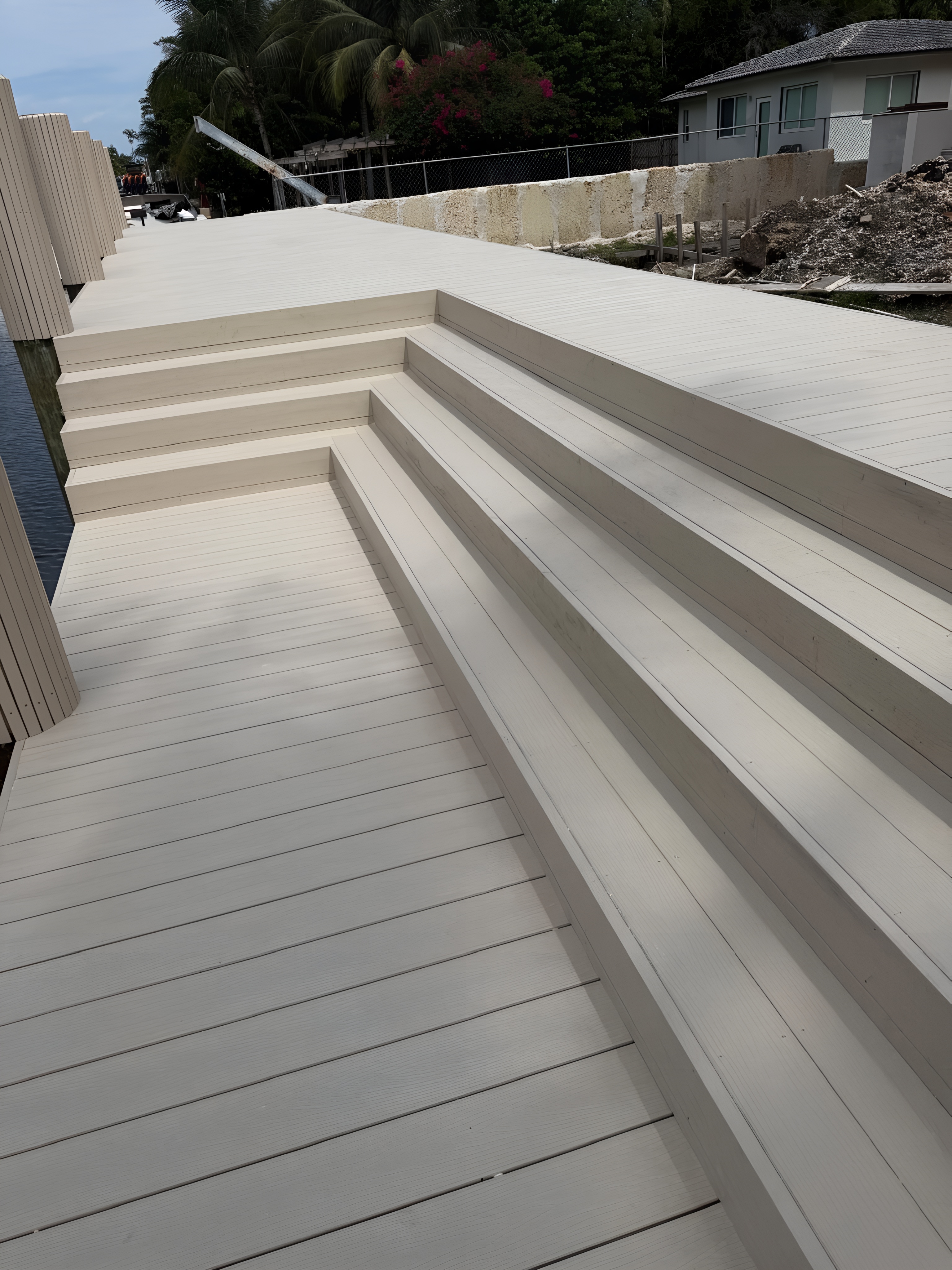 Finished composite dock with wide stair system and clean decking lines — Contour Marine
