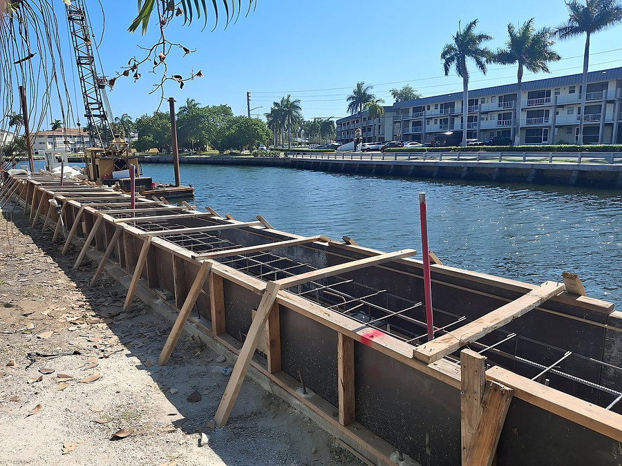 Seawall construction in progress — before transformation — South Florida by Contour Marine