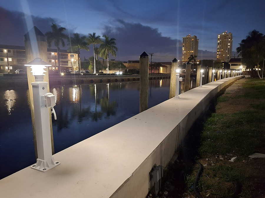 Completed seawall with integrated lighting at night — South Florida by Contour Marine